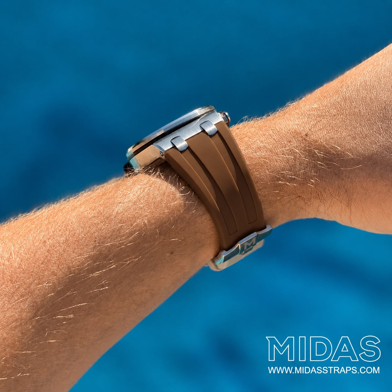 AP Royal Oak Offshore 42mm brown rubber replacement strap worn on wrist poolside MIDAS