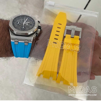 MIDAS Royal Oak Offshore 42mm yellow rubber strap on wrist outdoor pool background