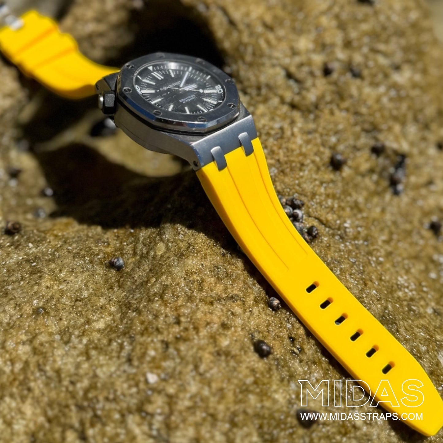 MIDAS Royal Oak Offshore 42mm yellow rubber strap on wrist outdoor pool background