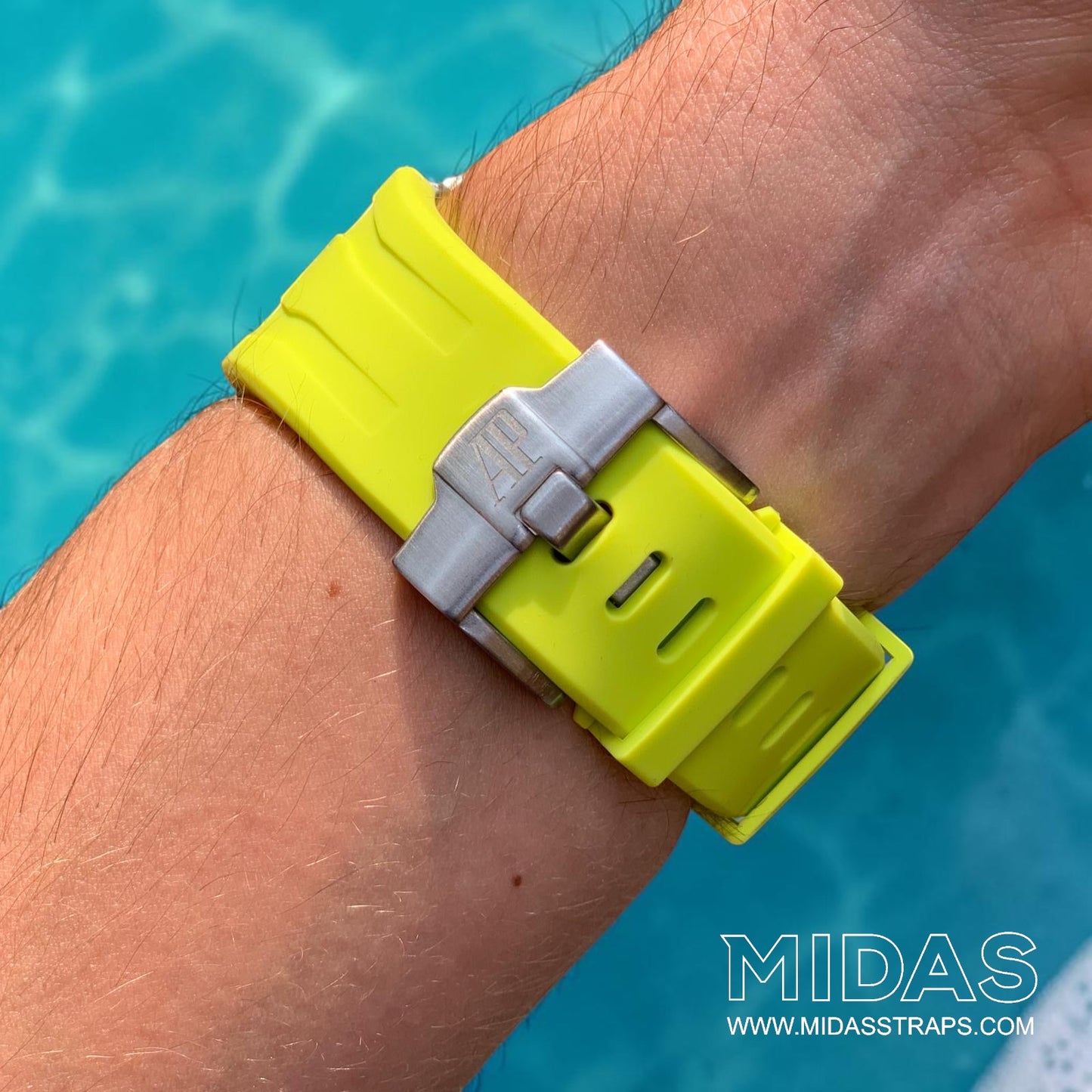 Close-up of an acid lime green replacement rubber strap and clasp fitted to an AP Royal Oak Offshore 26400 on wrist.