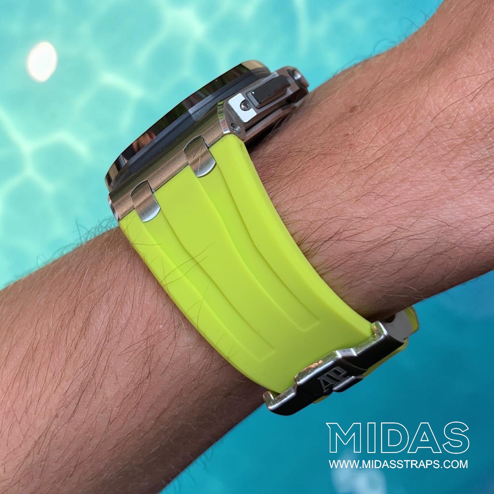 Side profile of an acid lime green replacement rubber strap fitted to an Audemars Piguet Royal Oak Offshore 44mm watch on wrist.
