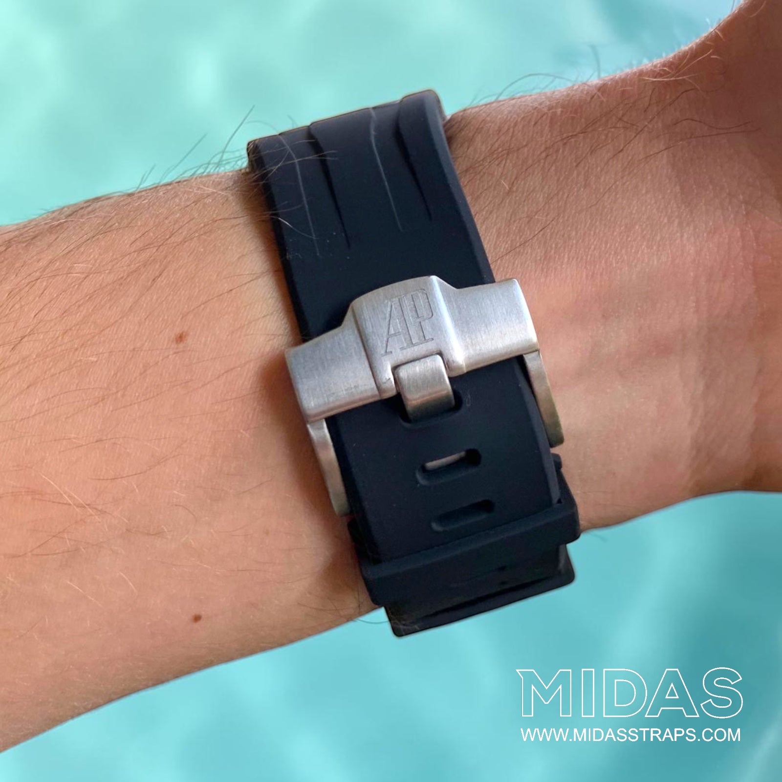 Side profile of a black OEM replacement rubber strap fitted to an Audemars Piguet Royal Oak Offshore 44mm watch on wrist.