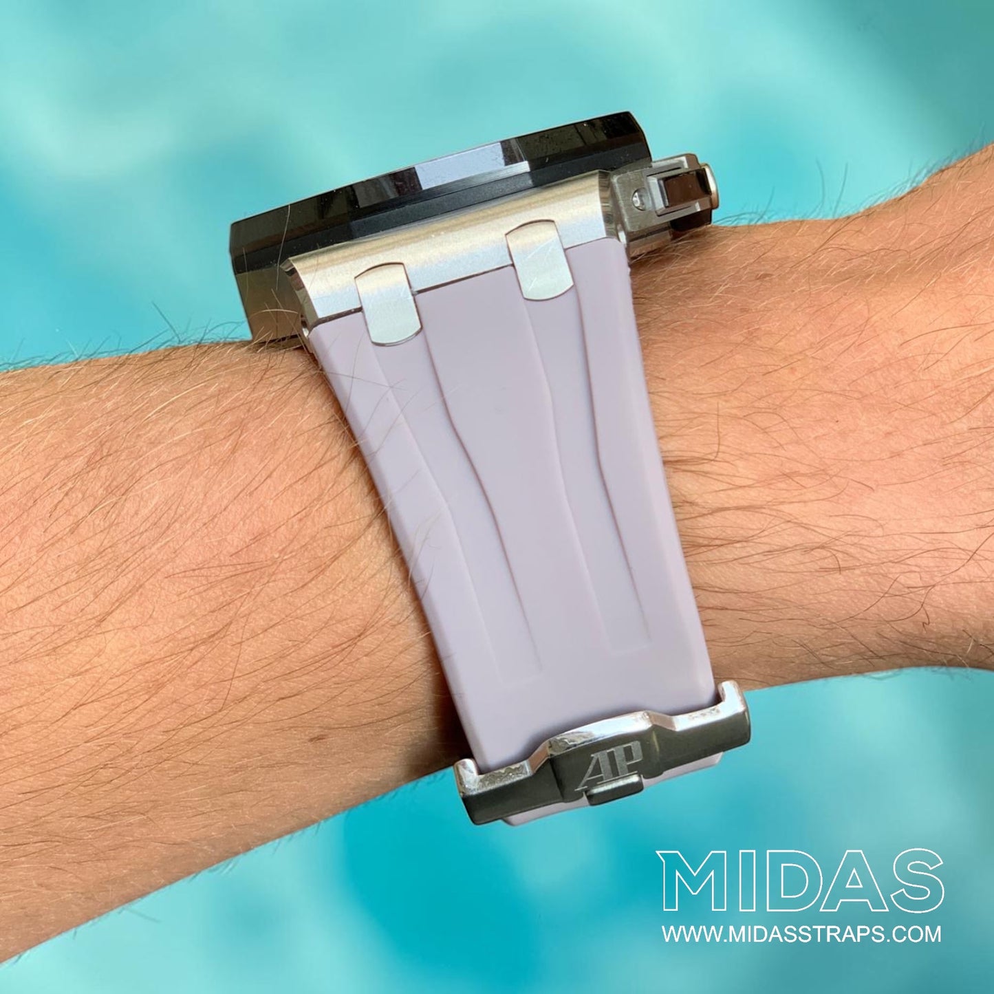 Side profile of a blush pink grey replacement rubber strap fitted to an AP Royal Oak Offshore 26400 on wrist.