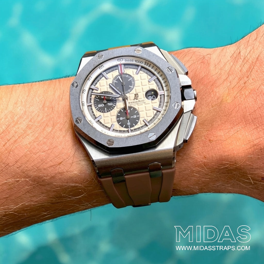 Brown replacement rubber strap installed on an Audemars Piguet Royal Oak Offshore 44mm watch shown on wrist.