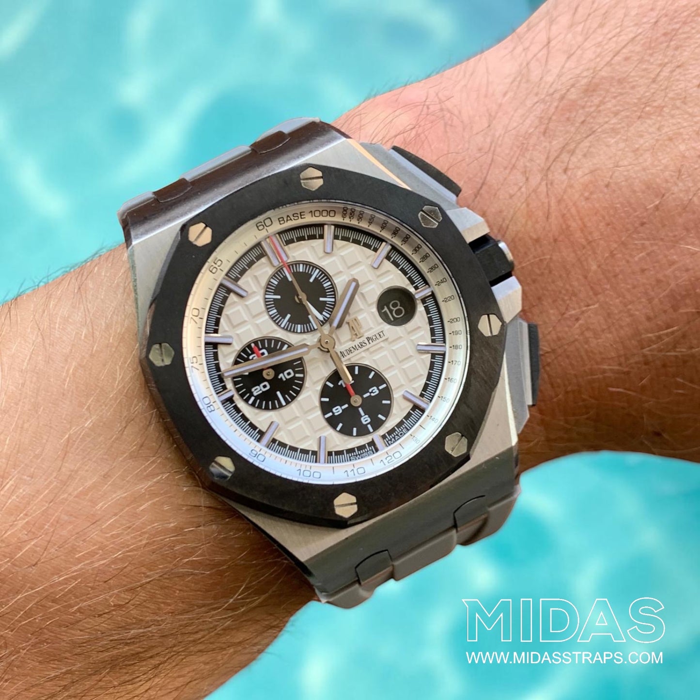 Grey replacement rubber strap by MIDAS Straps fitted to an Audemars Piguet Royal Oak Offshore 44mm watch in an outdoor wrist photograph.