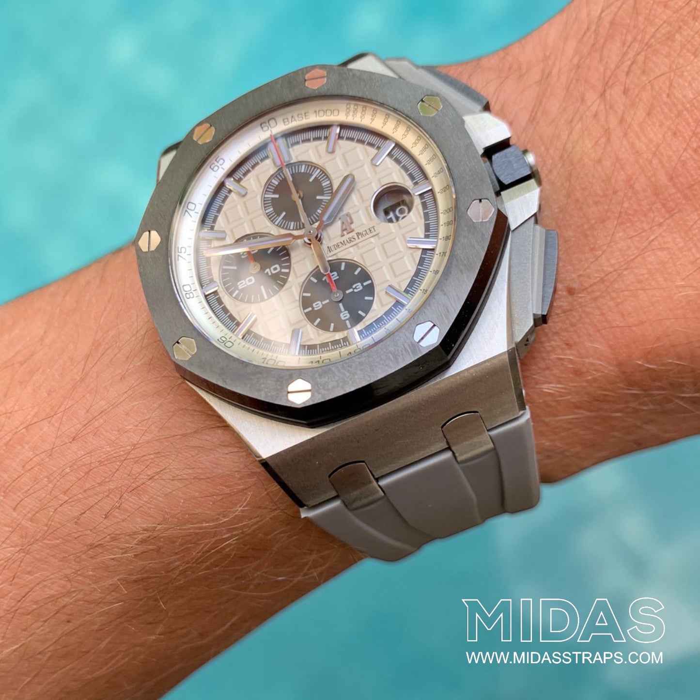 Grey replacement rubber strap fitted to an Audemars Piguet Royal Oak Offshore 44mm watch in a lifestyle wrist shot.