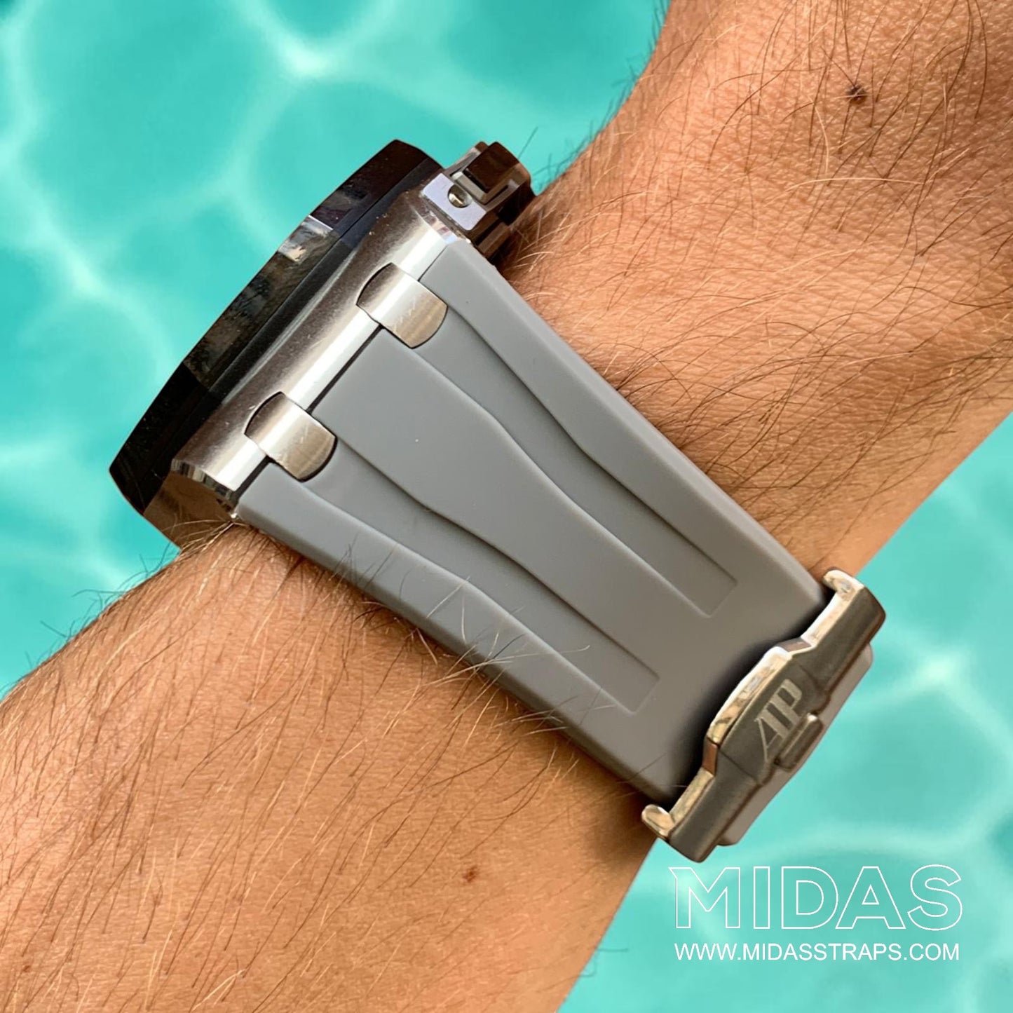 Side profile of an AP Royal Oak Offshore 26400 fitted with a grey replacement rubber strap on wrist.
