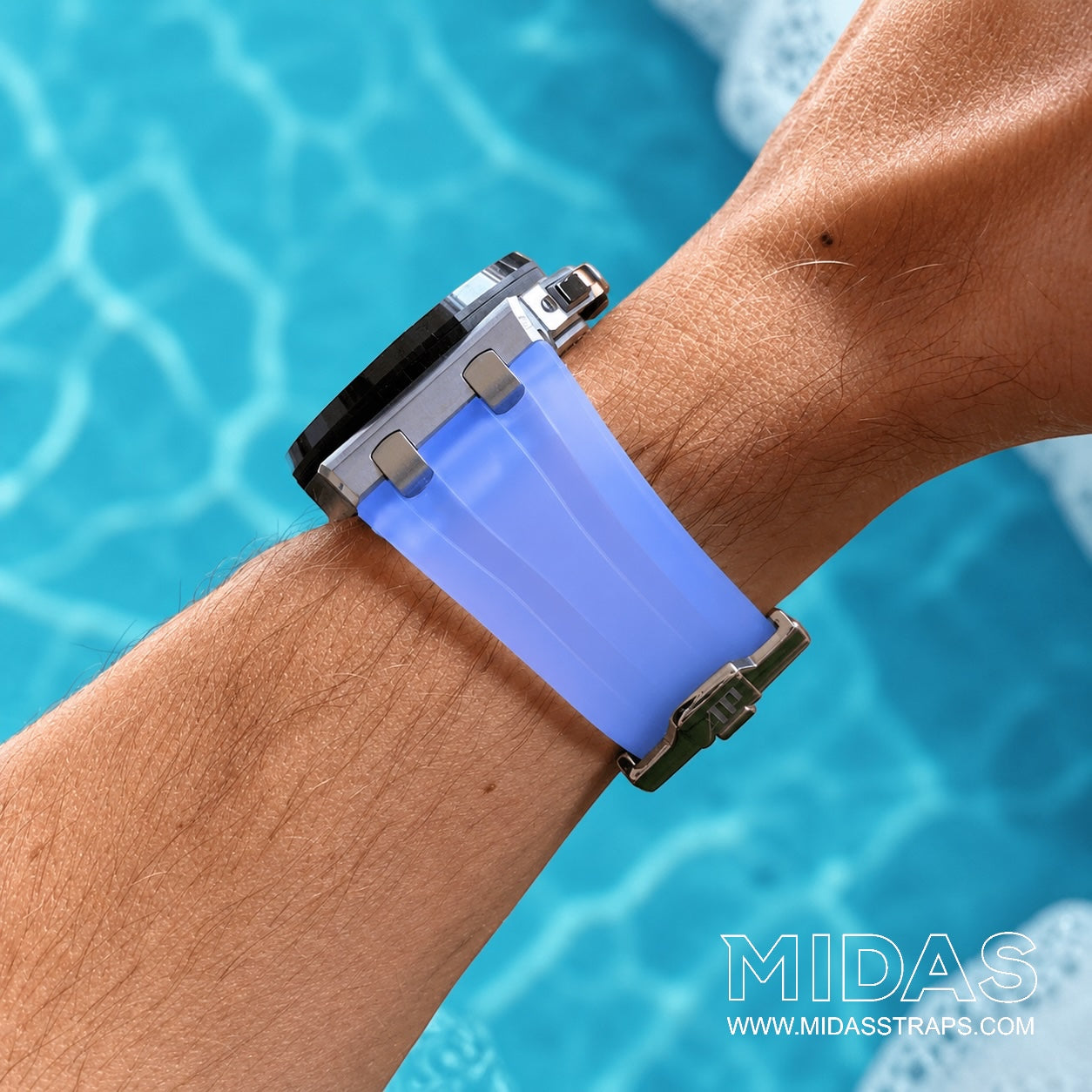 Transparent ice blue replacement rubber strap fitted to an Audemars Piguet Royal Oak Offshore 44mm watch on wrist beside a swimming pool.