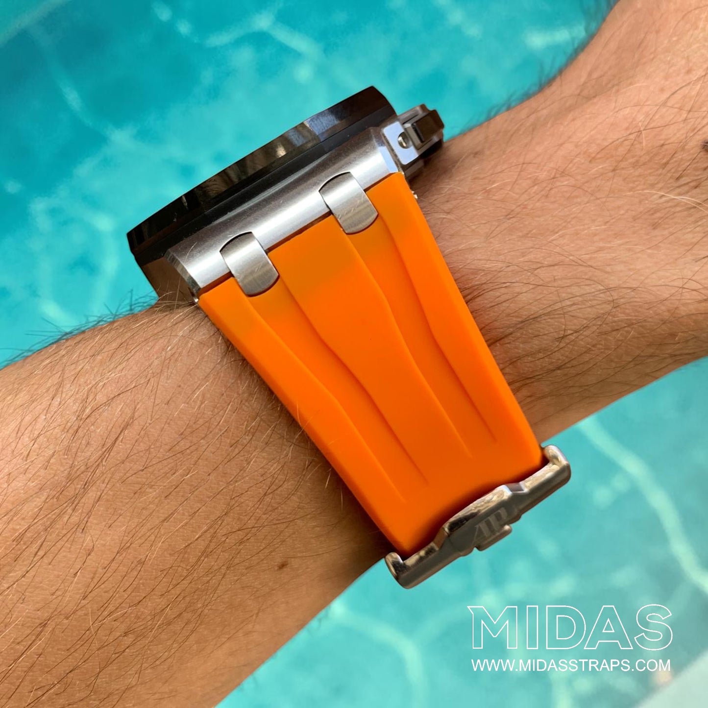 Side profile of an orange replacement rubber strap fitted to an Audemars Piguet Royal Oak Offshore 44mm watch on wrist.