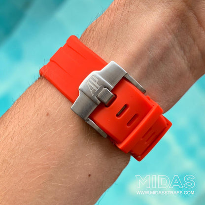 Close-up of a red replacement rubber strap and clasp fitted to an AP Royal Oak Offshore 26400 on wrist.