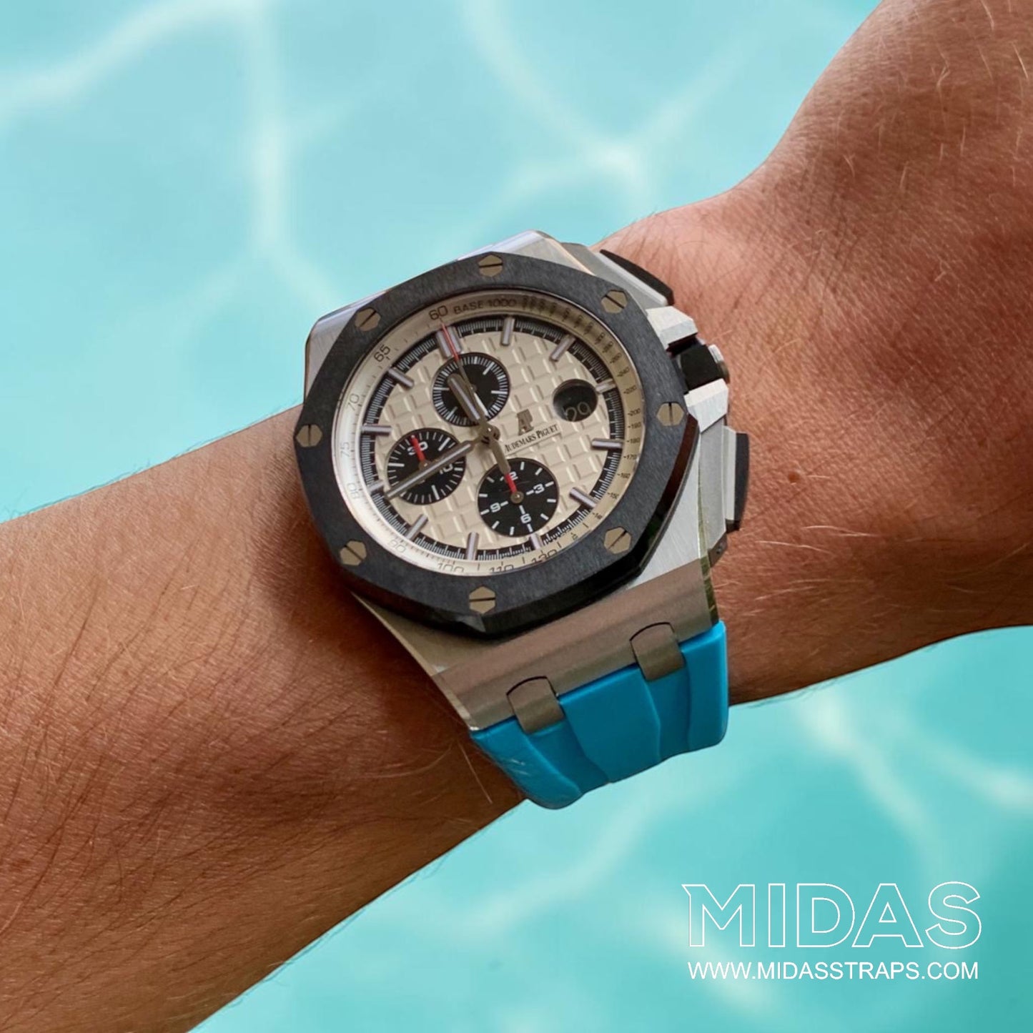 AP Royal Oak Offshore 26400 fitted with a light blue replacement rubber strap in an outdoor lifestyle wrist shot.