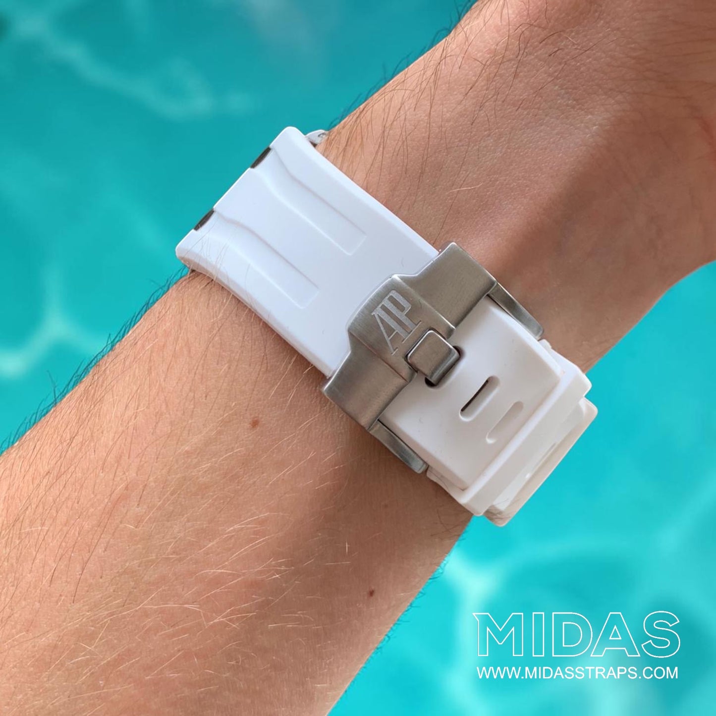 Close-up of a white replacement rubber strap and clasp fitted to an AP Royal Oak Offshore 26400 on wrist.