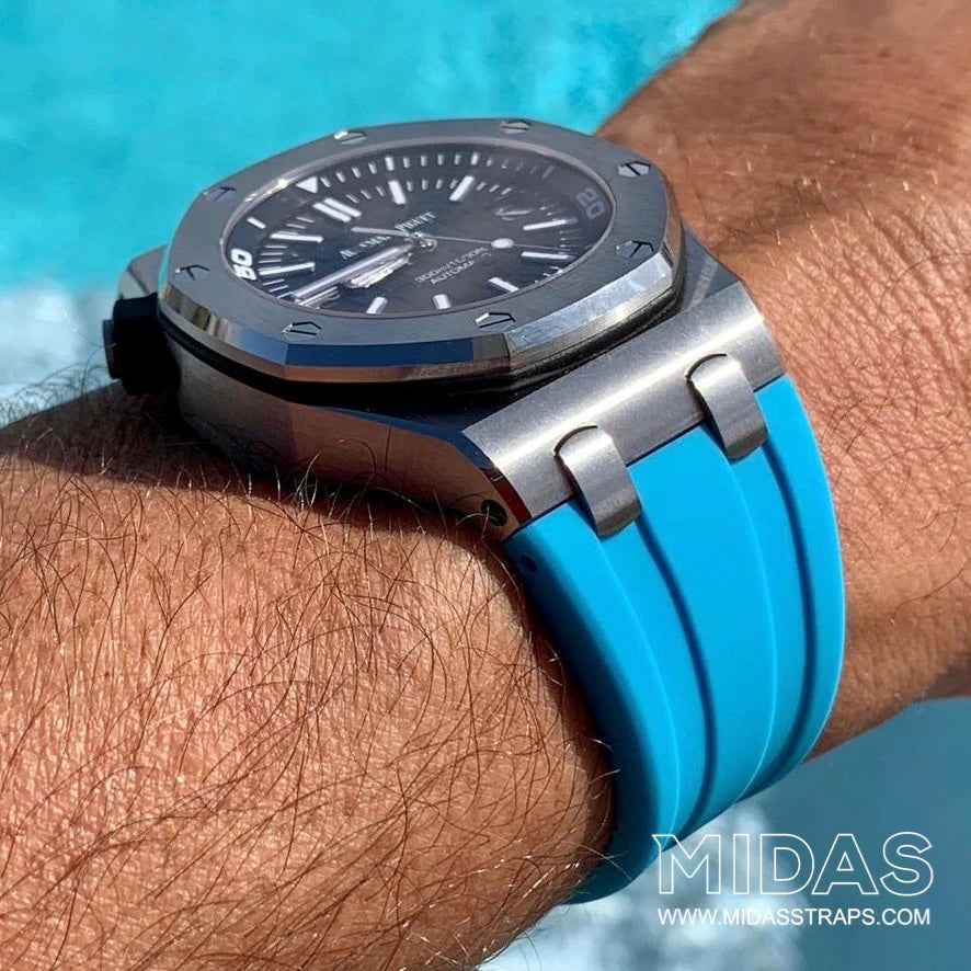 AP Royal Oak Offshore 42mm blue rubber replacement strap worn on wrist poolside MIDAS