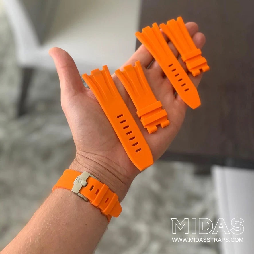 MIDAS Royal Oak Offshore 42mm orange rubber strap on wrist outdoor pool background